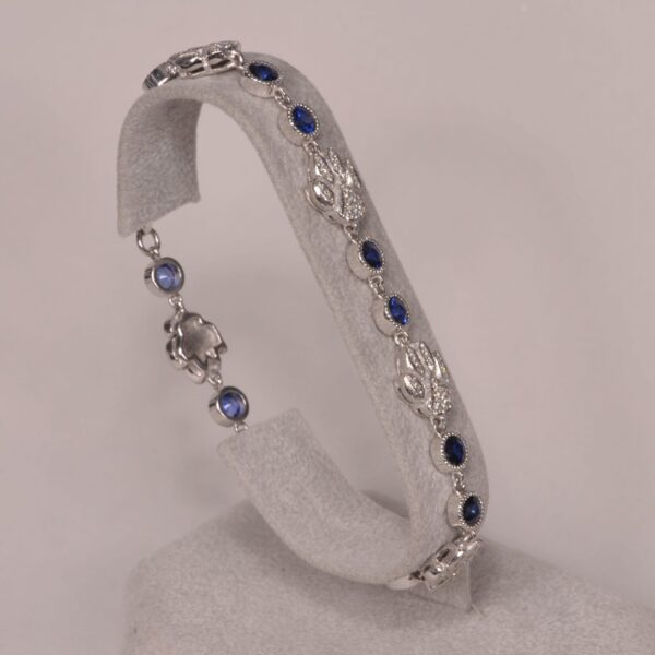 14K white gold diamond and sapphire cat paw bracelet