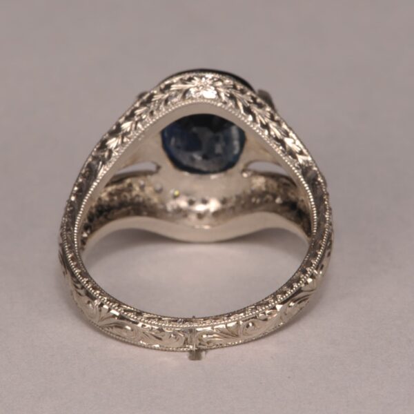 Midnight blue sapphire and diamond ring, fine deep color