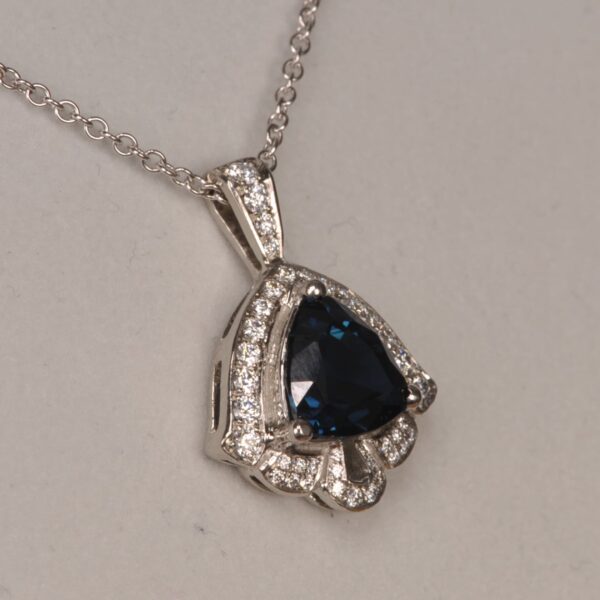 Deep blue sapphire and diamond pendant, deep midnight blue color