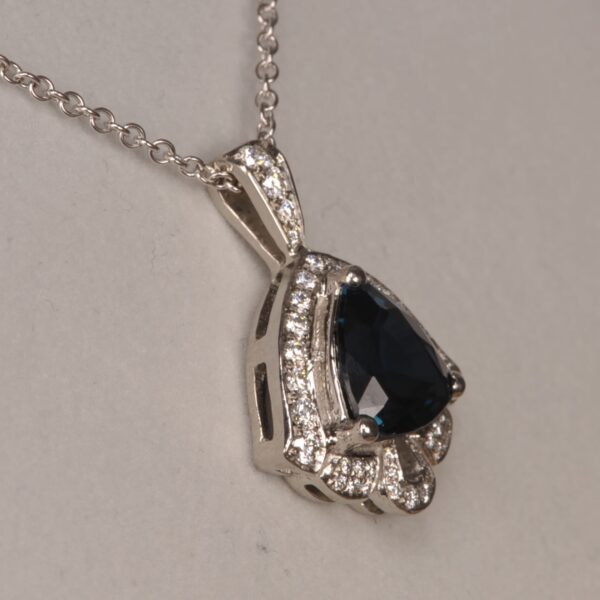 Deep blue sapphire and diamond pendant, deep midnight blue color