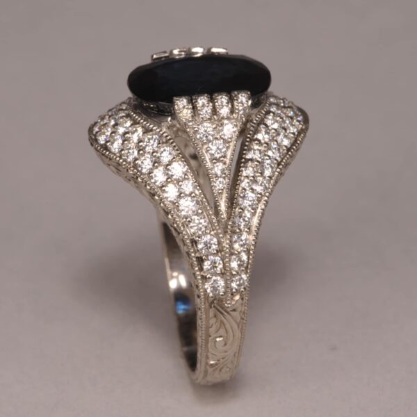 Midnight blue sapphire and diamond ring, fine deep color