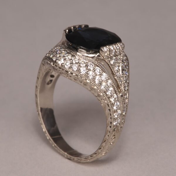 Midnight blue sapphire and diamond ring, fine deep color