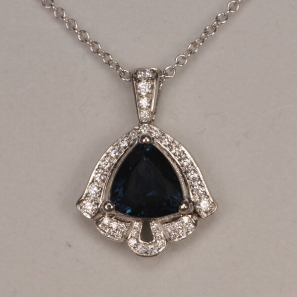 Deep blue sapphire and diamond pendant, deep midnight blue color