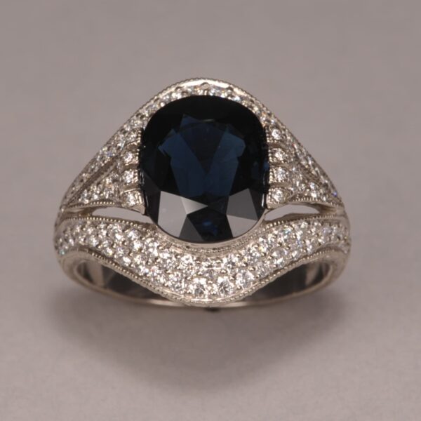 Midnight blue sapphire and diamond ring, fine deep color