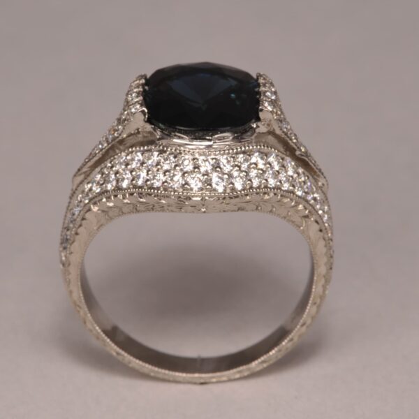 Midnight blue sapphire and diamond ring, fine deep color