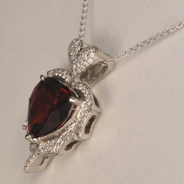 Stunning heart shaped rhodolite and diamond pendant. Brand new