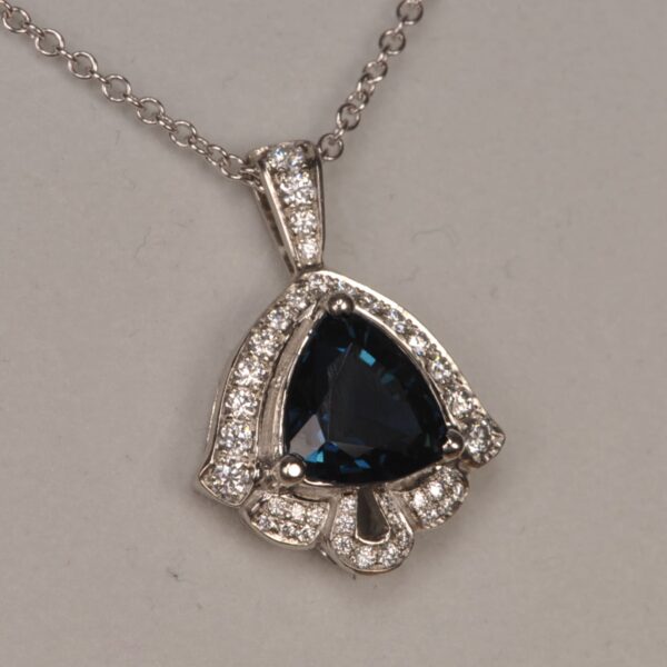 Deep blue sapphire and diamond pendant, deep midnight blue color