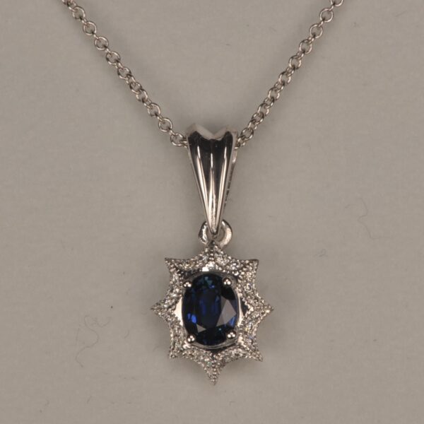 Blue sapphire and diamond pendant with chain, midnight blue color