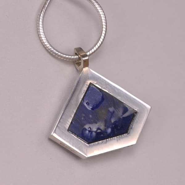 Deep blue lapis and enamel geometric silver pendant